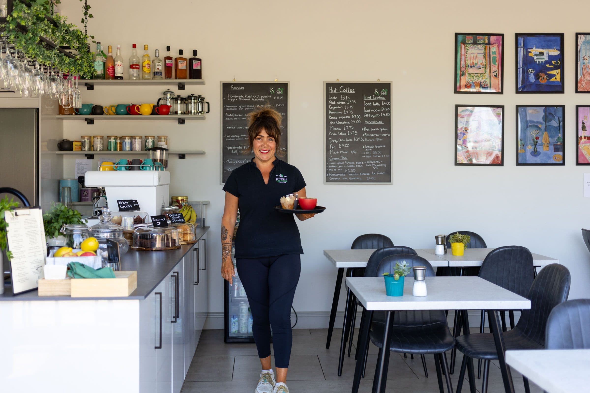 Café staff serving customers at Knowle Grange